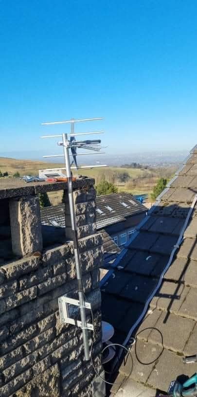 External chimney-mounted TV aerial with a masthead amplifier fitted at the aerial end of the cable