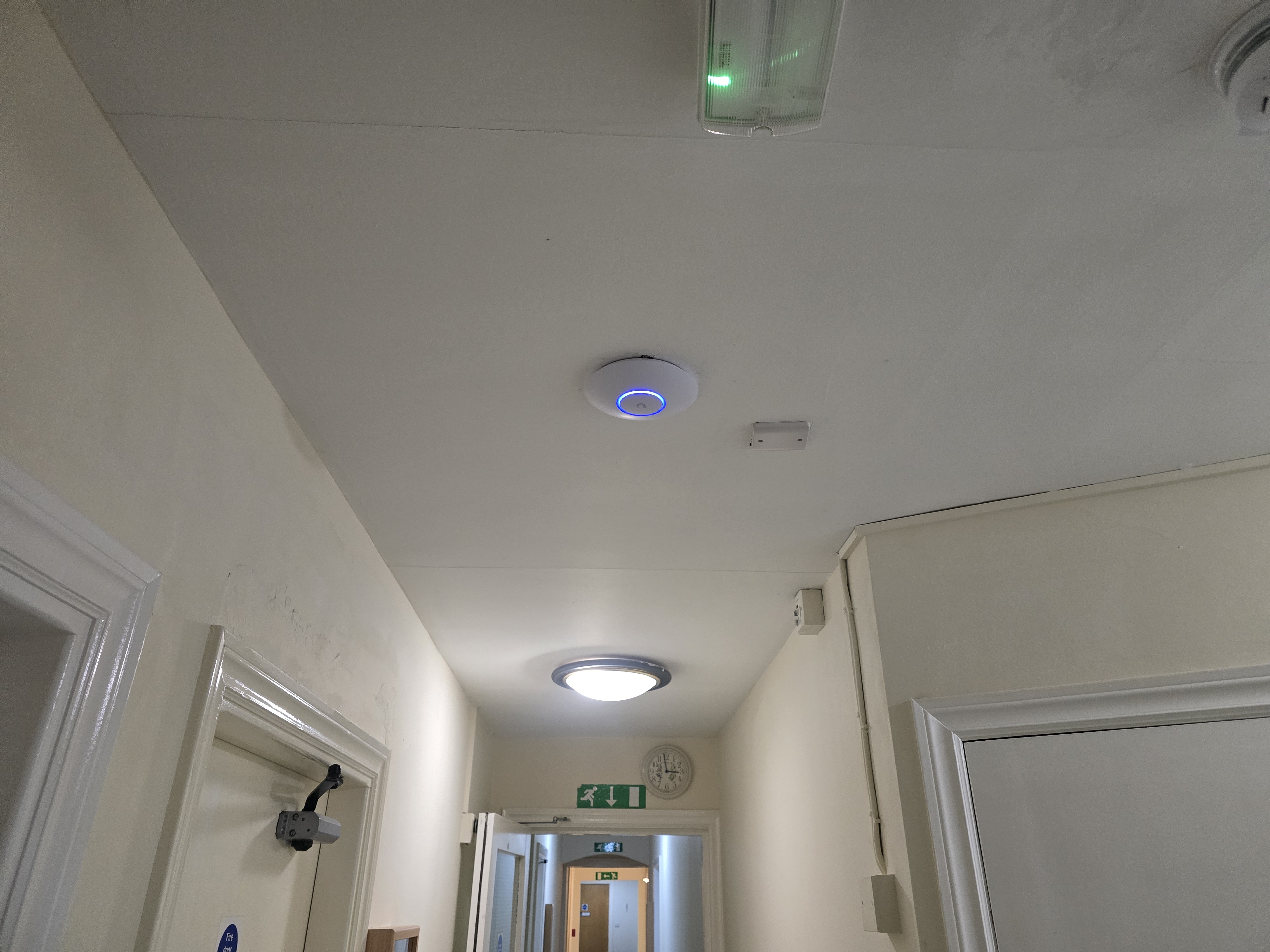 Ubiquiti wireless access point mounted to a care home ceiling