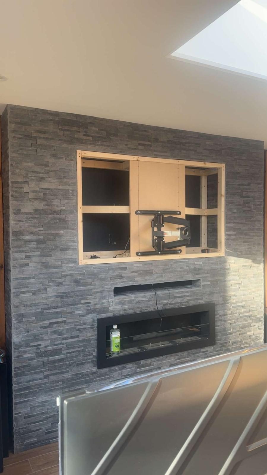 Before and after TV wall mounting install showing cable tidy in Stockport