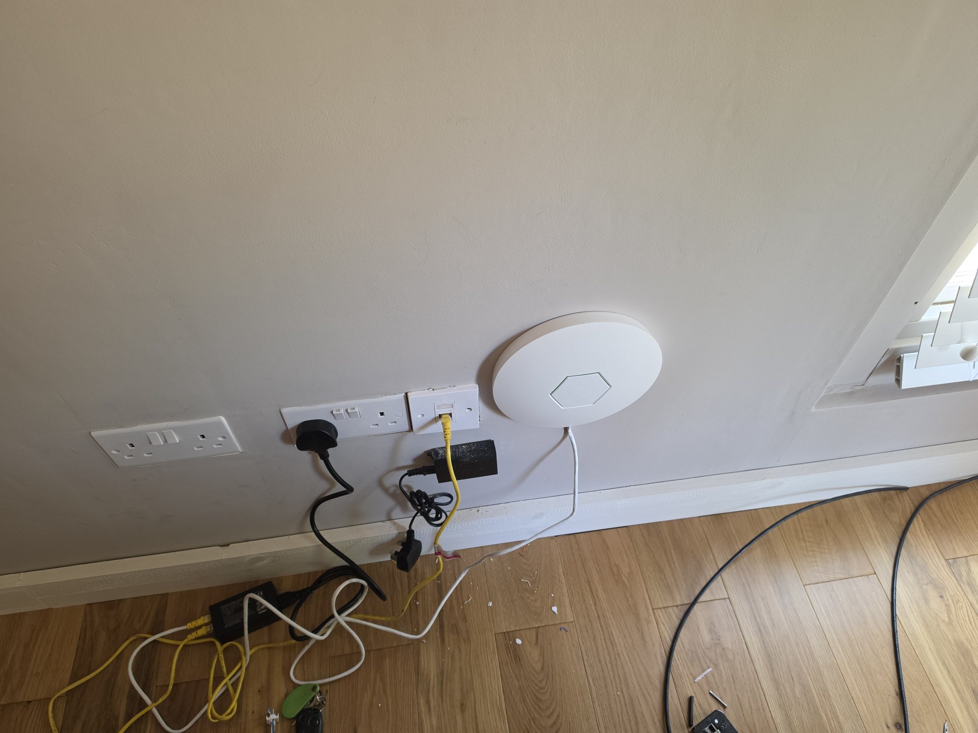 Ceiling-mounted Wi-Fi access point installed as part of a home network