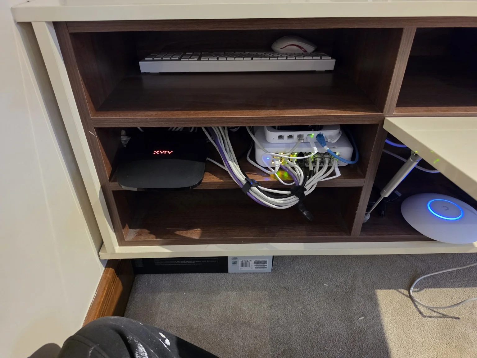 Reorganised network equipment and Ethernet patching in a cabinet after the managed UniFi rebuild in Cheadle