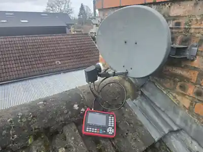 Satellite dish and LNB being signal-tested during an Evolution Data & Digital job in Bramhall