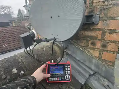 Signal meter connected at a satellite dish during an Evolution Data & Digital Bramhall visit
