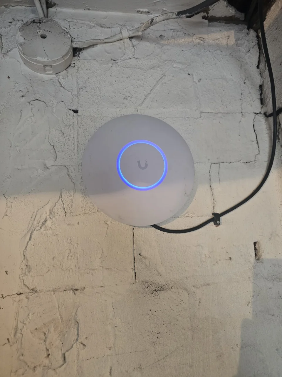 UniFi wireless access point installed to improve living-room Wi-Fi coverage in Prestwich