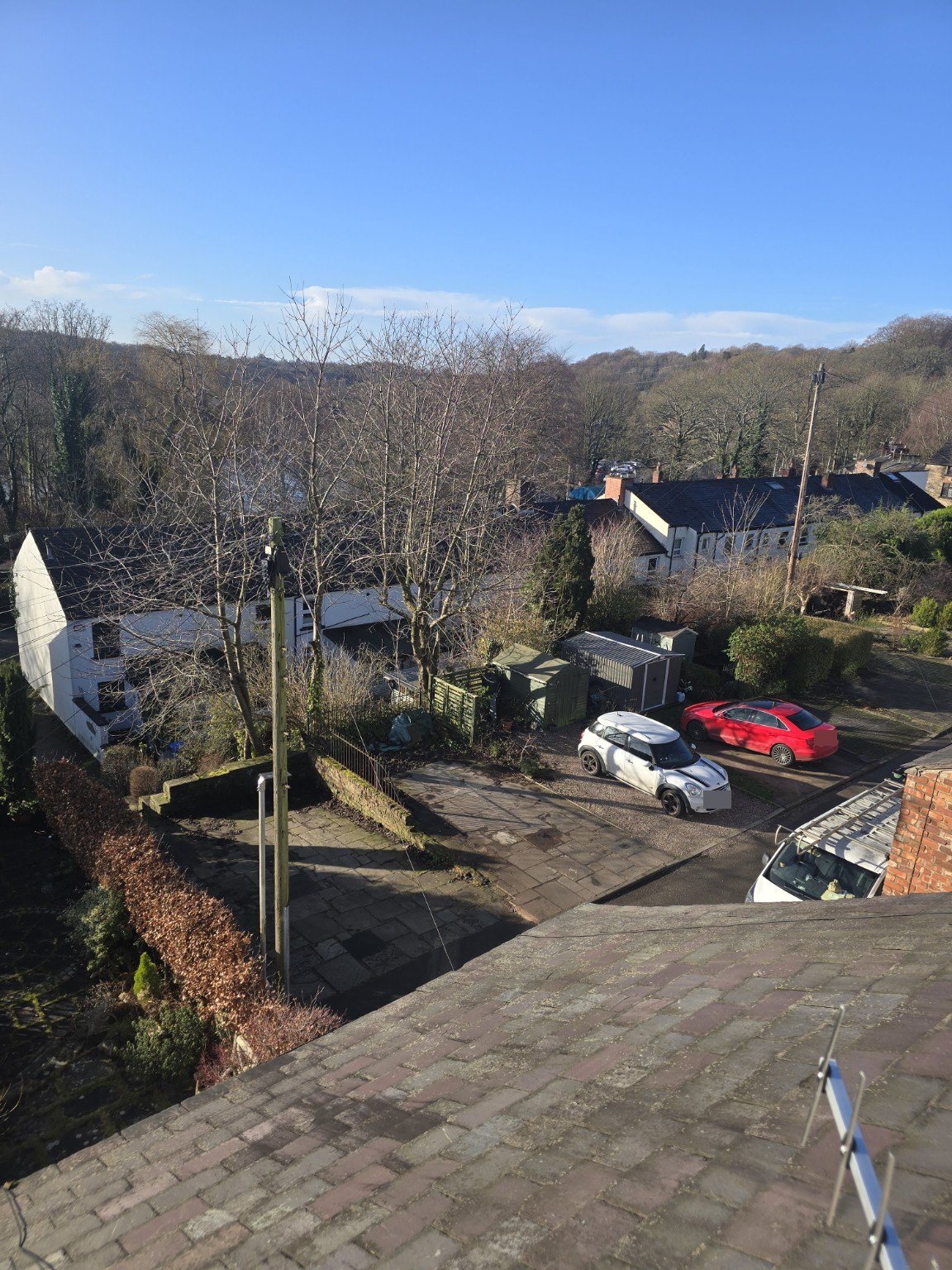 Elevated view towards woodland and homes around Etherow Country Park in Compstall.