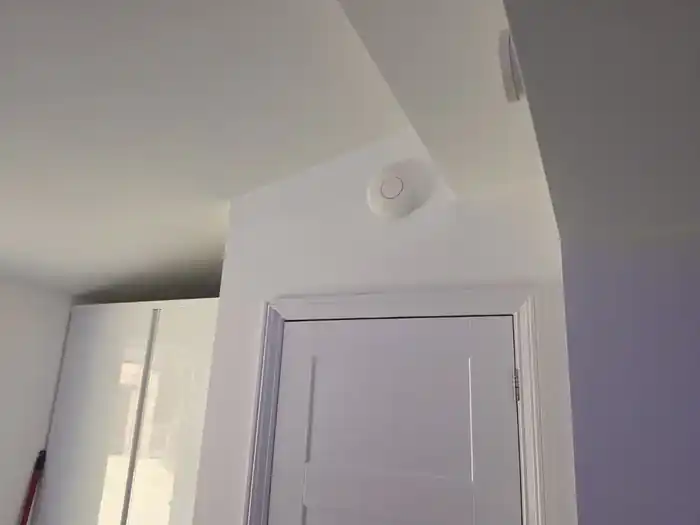 Ceiling-mounted wireless access point installed by Evolution Data & Digital on an SK4 network project